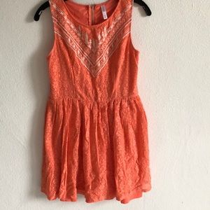 Orange dress with design on bodice